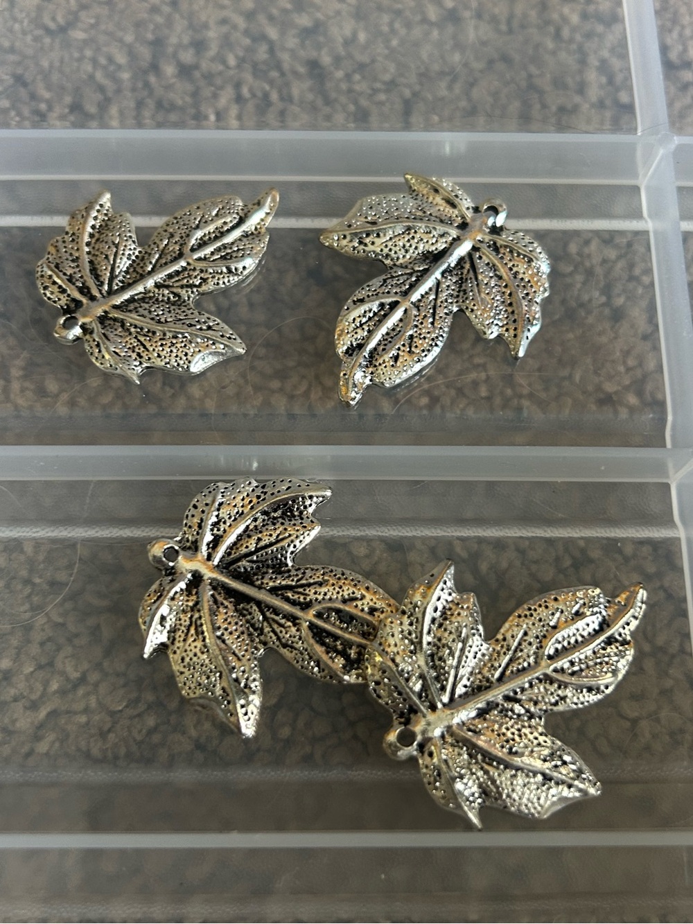 Lot of 10 silver-tone pendant charms with detailed, textured maple leaf design